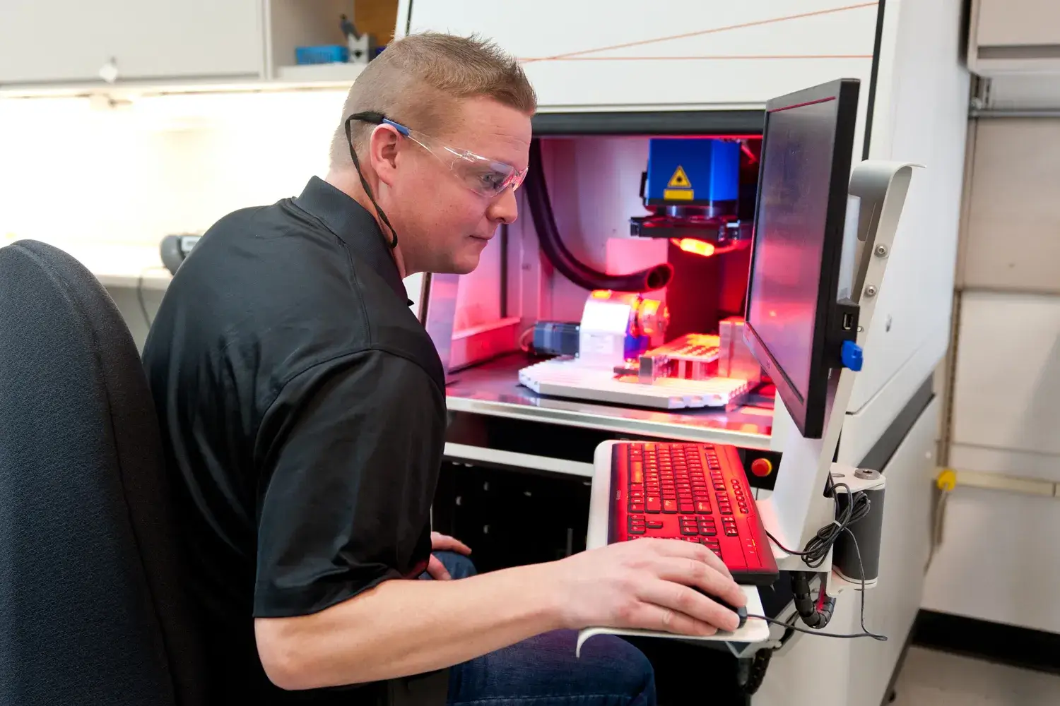 Full Production Manufacturing Near Me - MMT Employee Using Machine and Computer