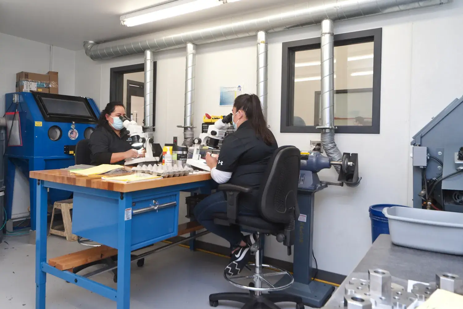 Staff using microscopes